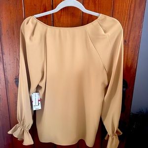 XS , Beautiful gold blouse, New with tags, never worn. Smoke free home.